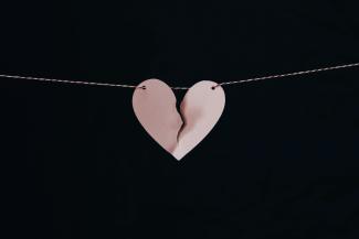 broken heart hanging on wire by Kelly Sikkema courtesy of Unsplash.
